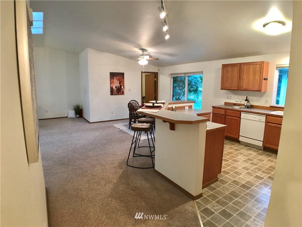 6018 Prather Road Southwest Centralia, WA 98531 - Photo 25 of 28 a living room with stainless steel appliances granite countertop furniture sink and mirror