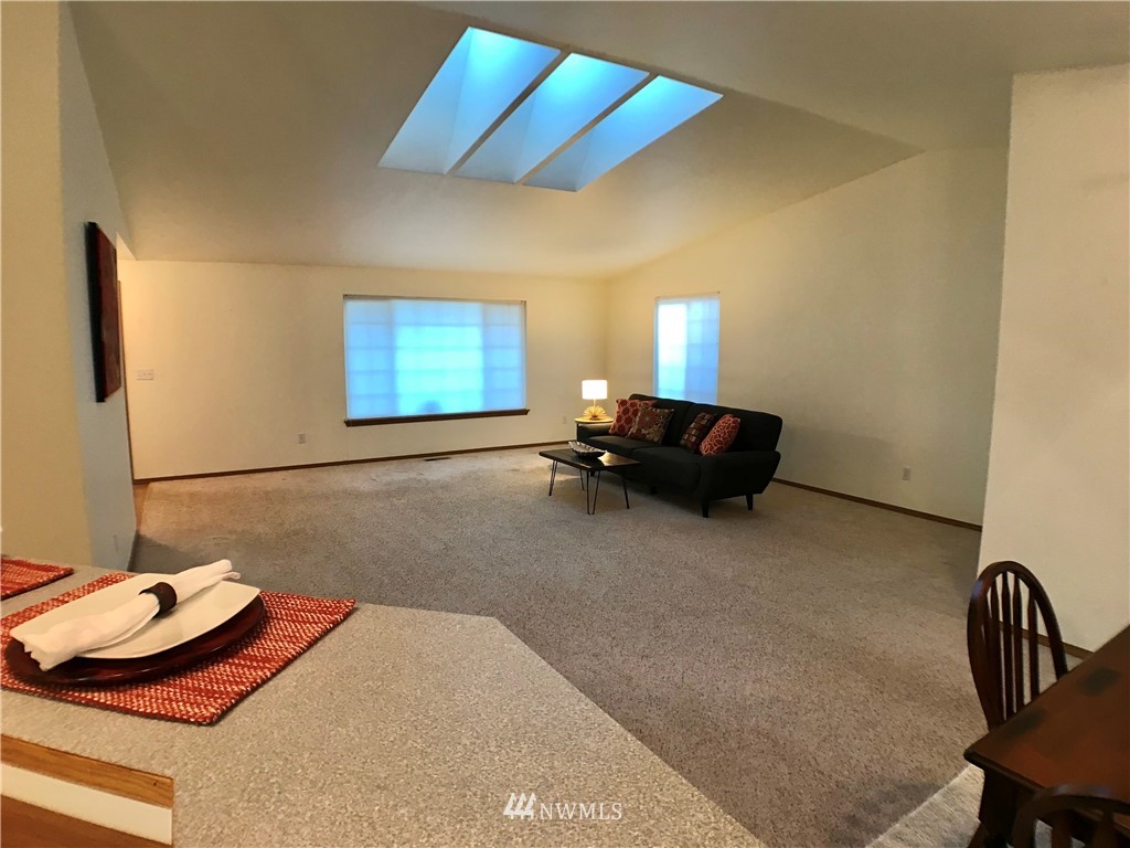 6018 Prather Road Southwest Centralia, WA 98531 - Photo 26 of 28 a living room with furniture and a chair