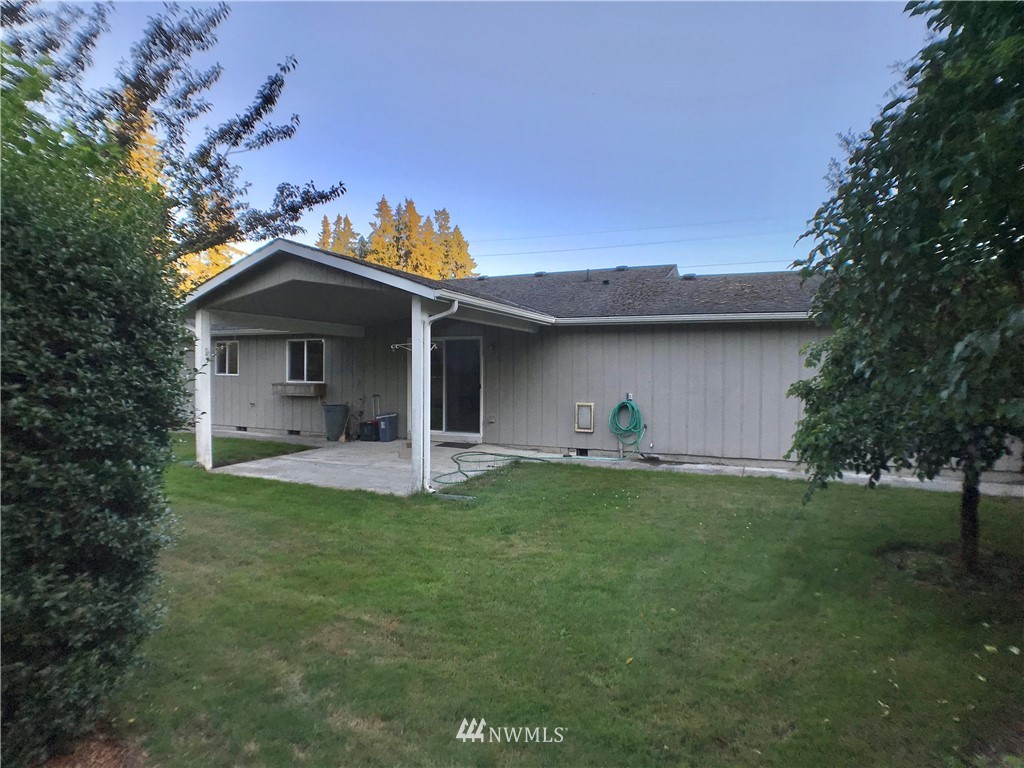6018 Prather Road Southwest Centralia, WA 98531 - Photo 9 of 28 a front view of a house with a yard and garage