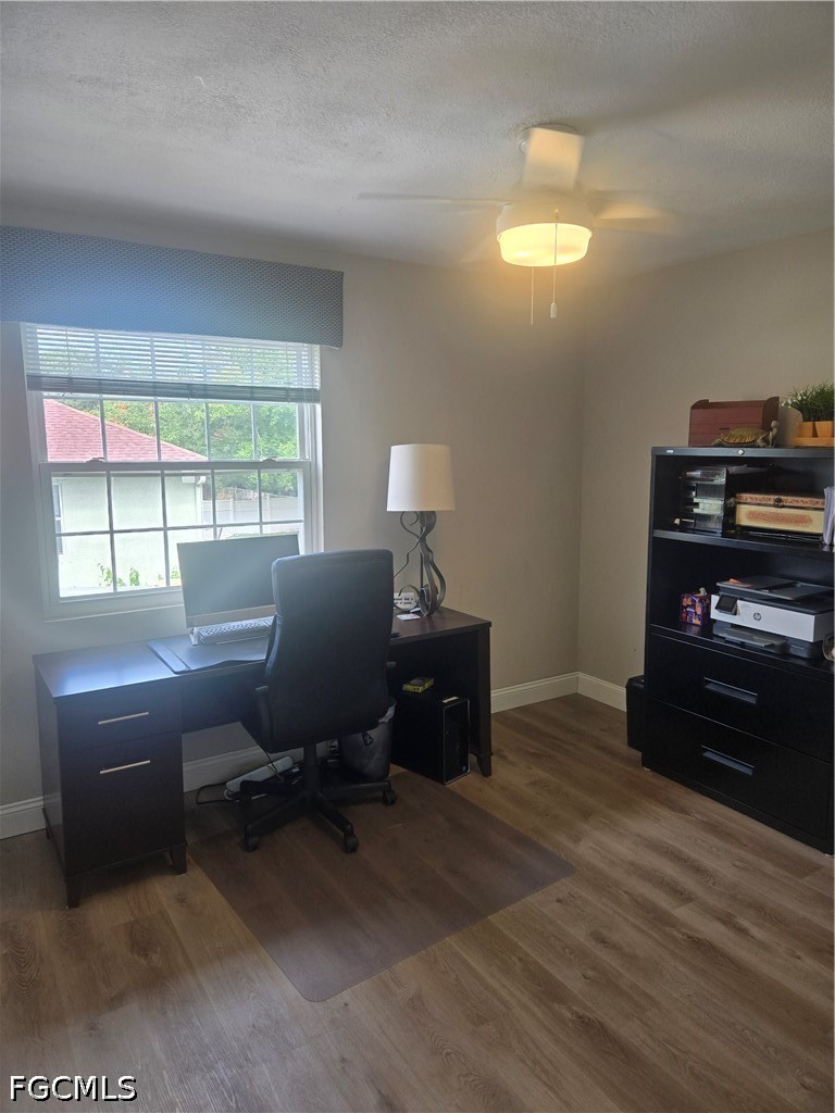 8093 Anhinga Road Fort Myers, FL 33967 - Photo 29 of 49 a view of a workspace with furniture and a window