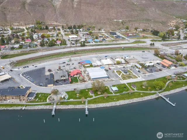 a view of swimming pool with a car parked in front of it