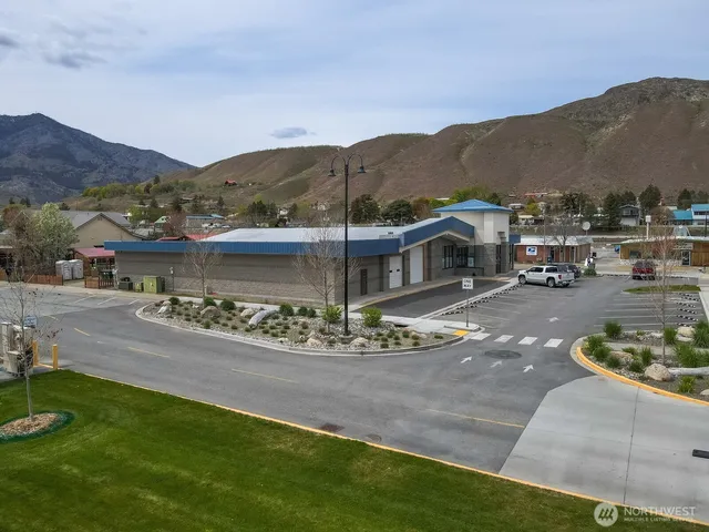 a view of a street with a mountain in the background