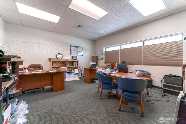 a view of a workspace with furniture