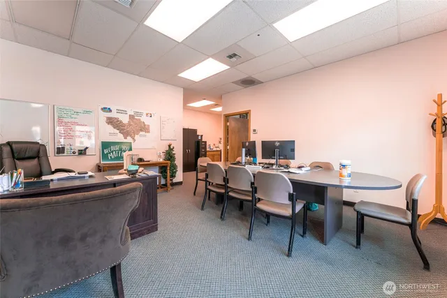 a view of a workspace with furniture
