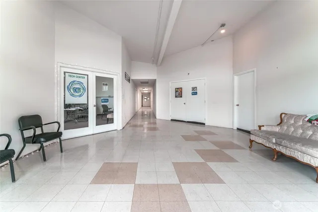 a view of a livingroom with furniture and windows