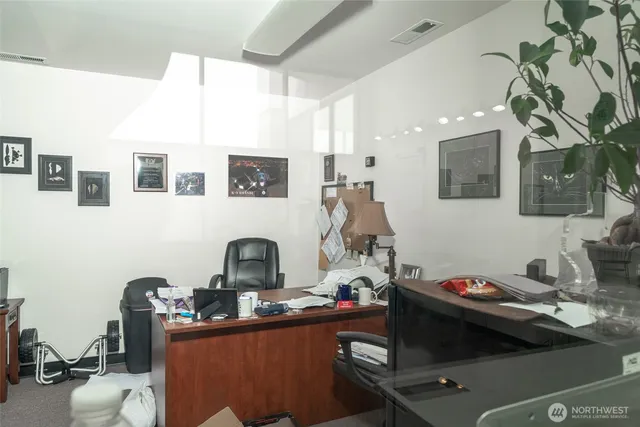 a kitchen with a sink appliances and cabinets