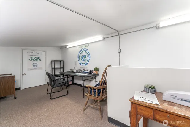 a view of a workspace with furniture