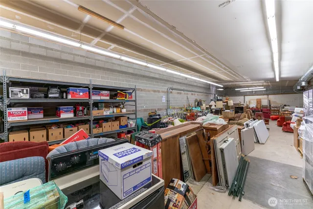 a utility room with lots of wooden furniture and a shelf
