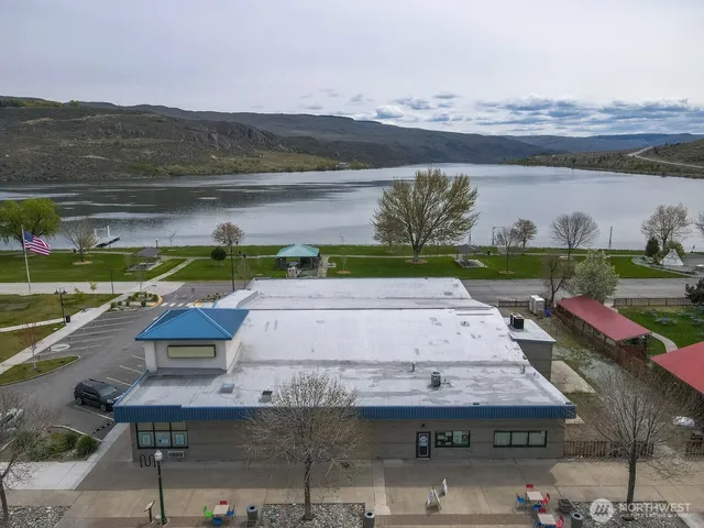 a view of a terrace with a table and chairs