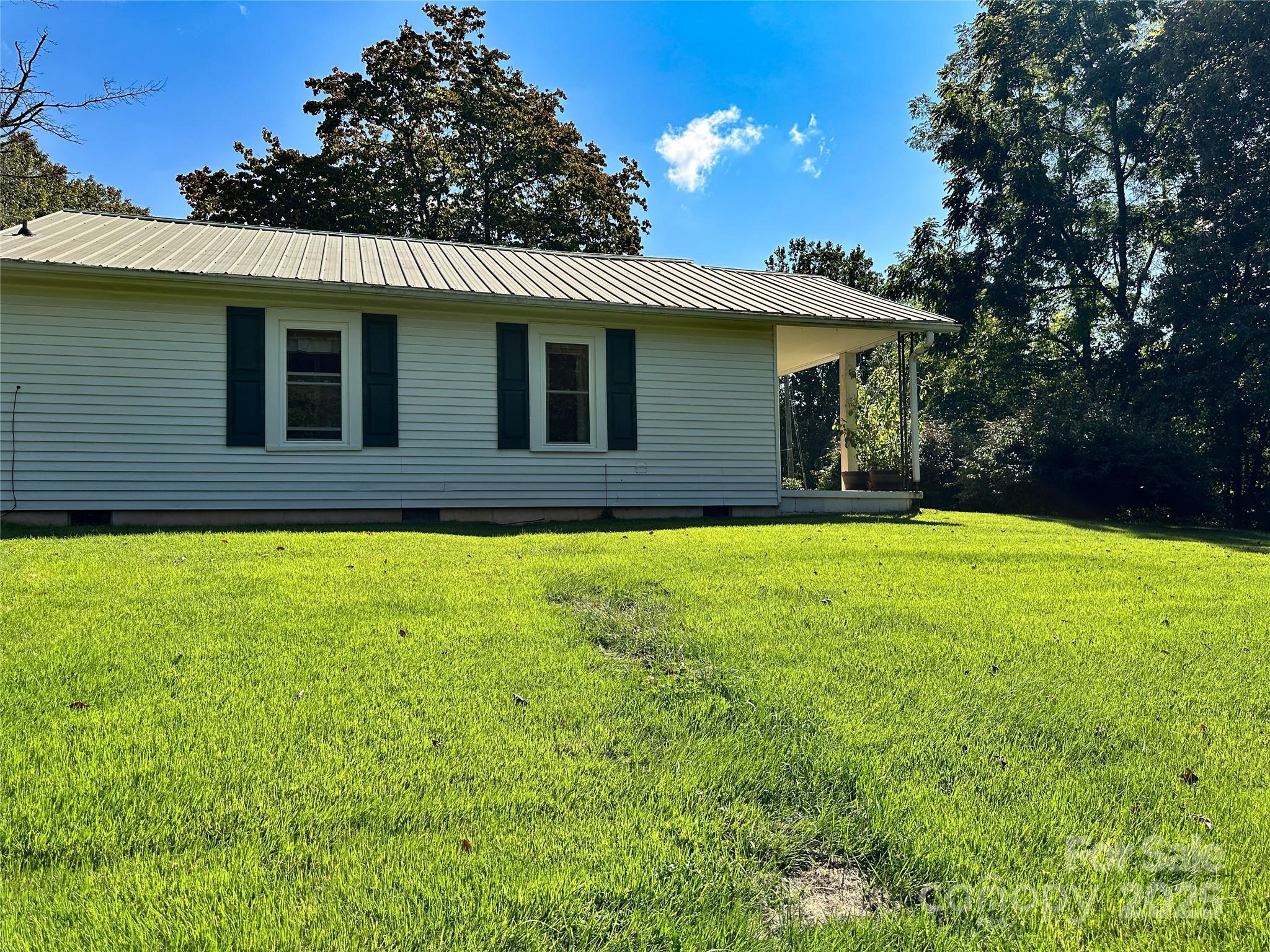 241 Canada Road Tuckasegee, NC 28783 - Photo 16 of 27 a front view of house with yard and green space