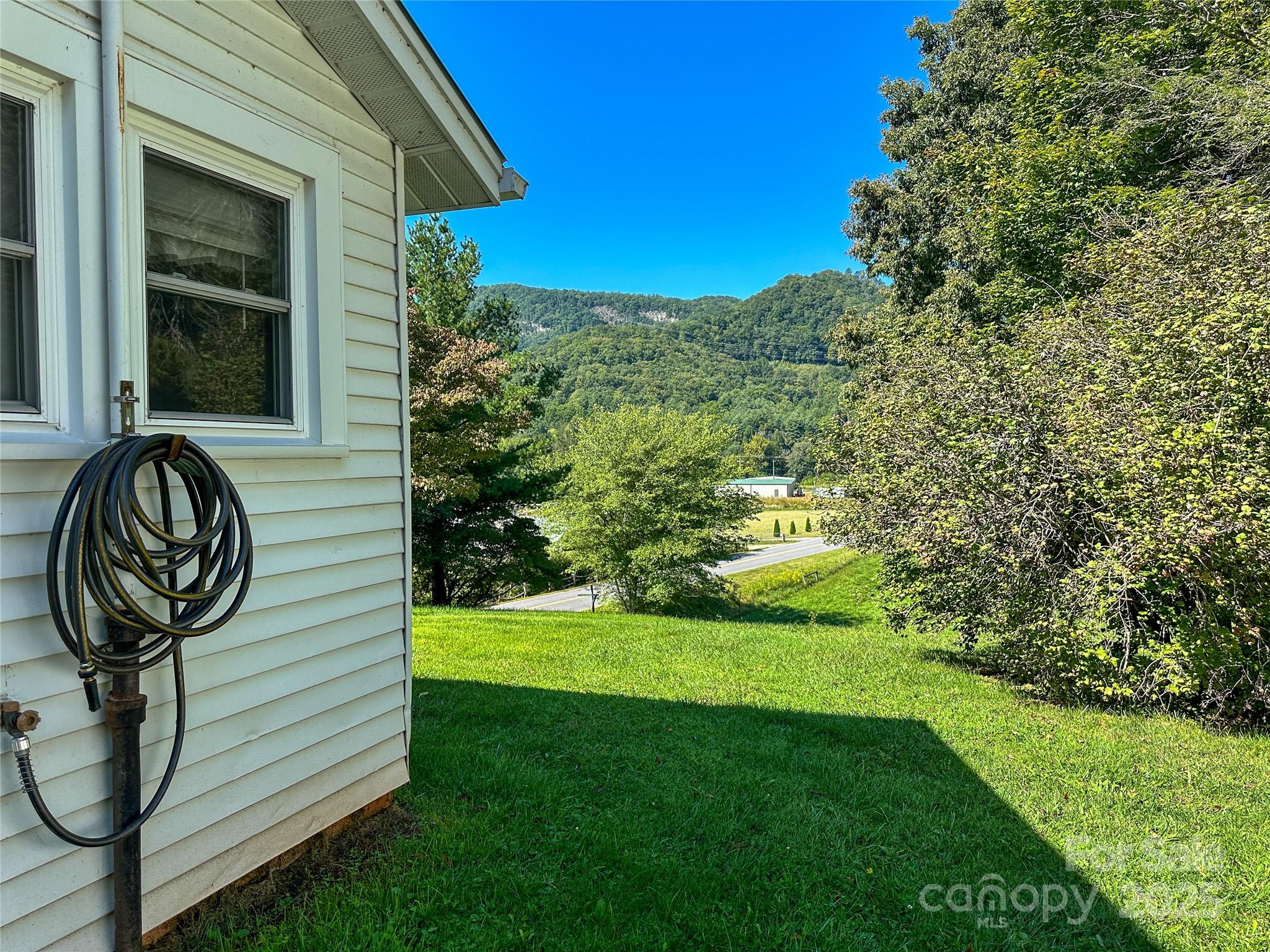 241 Canada Road Tuckasegee, NC 28783 - Photo 18 of 27 a view of a yard in front of a house