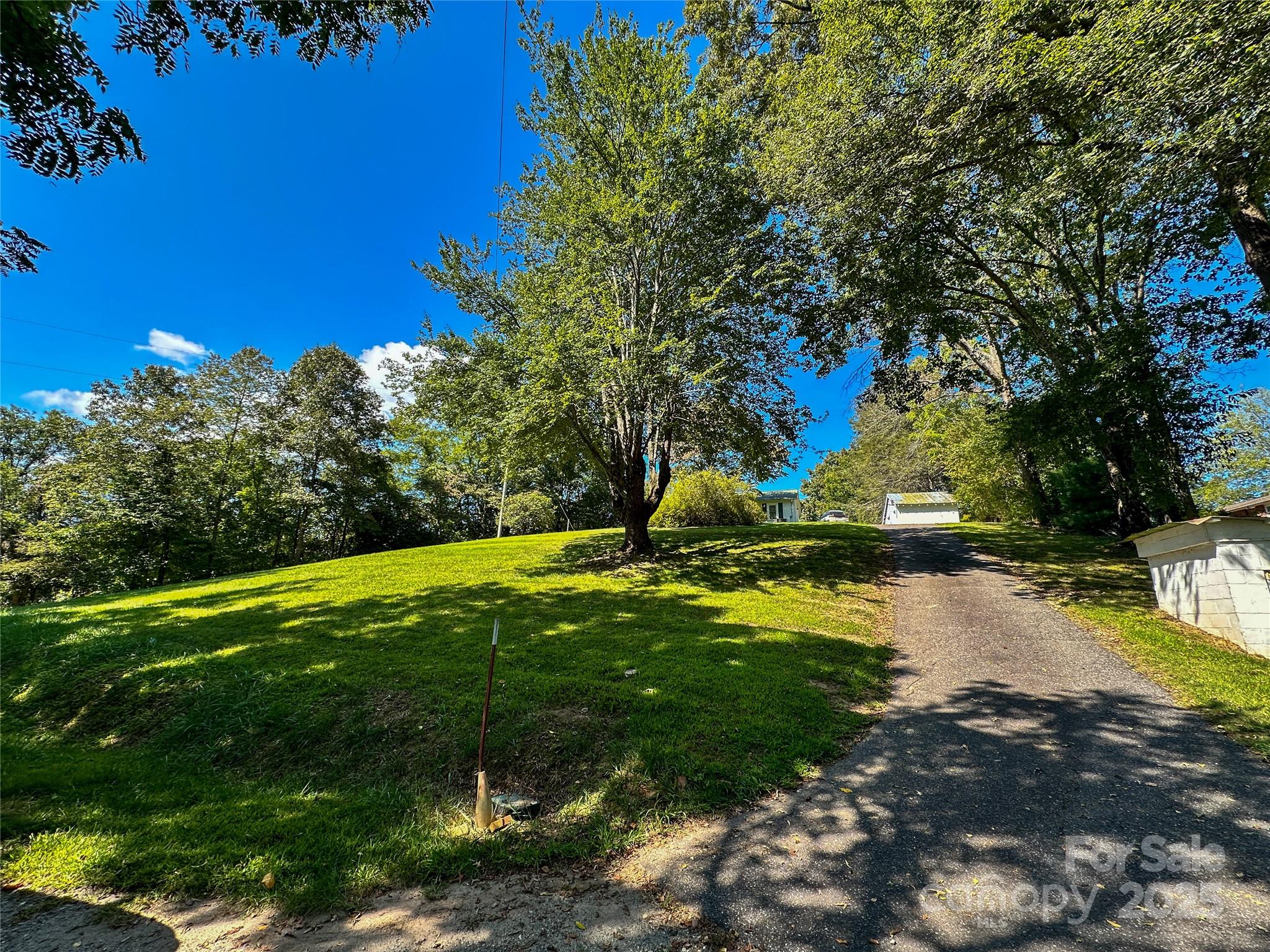 241 Canada Road Tuckasegee, NC 28783 - Photo 21 of 27 a view of swimming pool with a yard