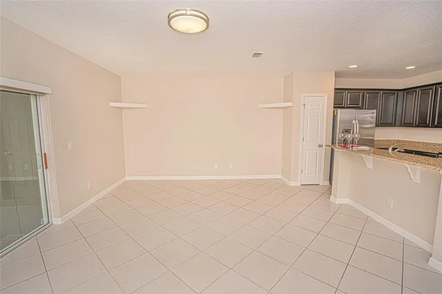 a view of kitchen with white cabinets