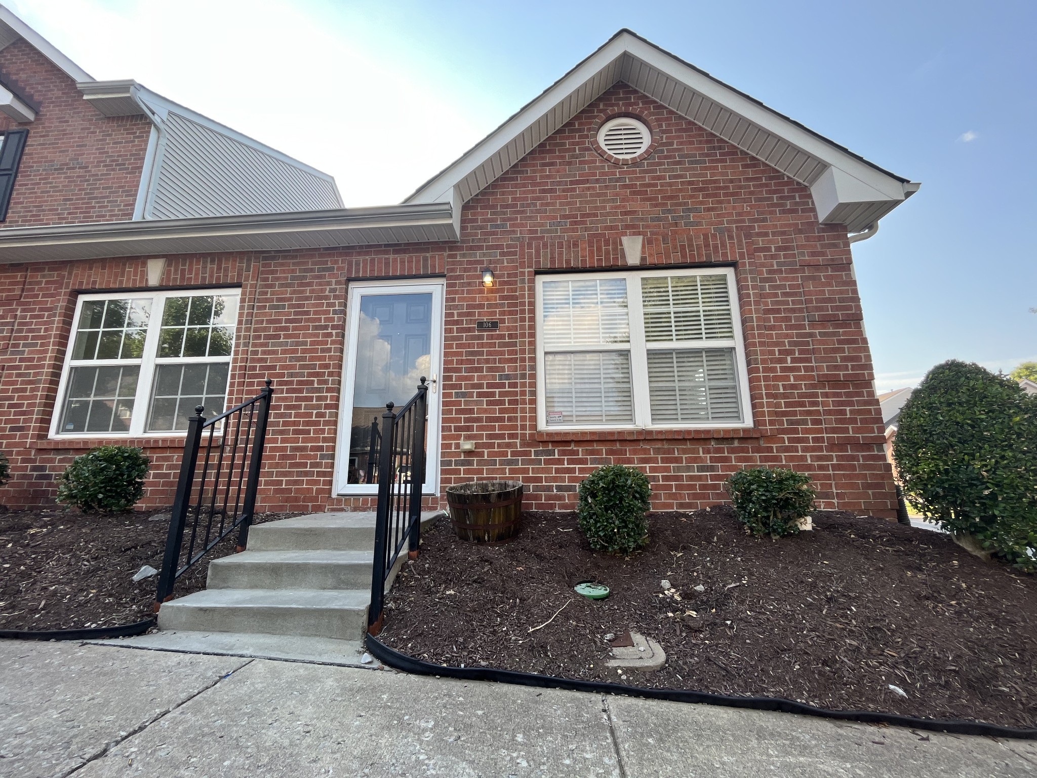 1101 Downs Boulevard, Unit 106 Franklin, TN 37064 - Photo 1 of 11 a front view of a house with a yard