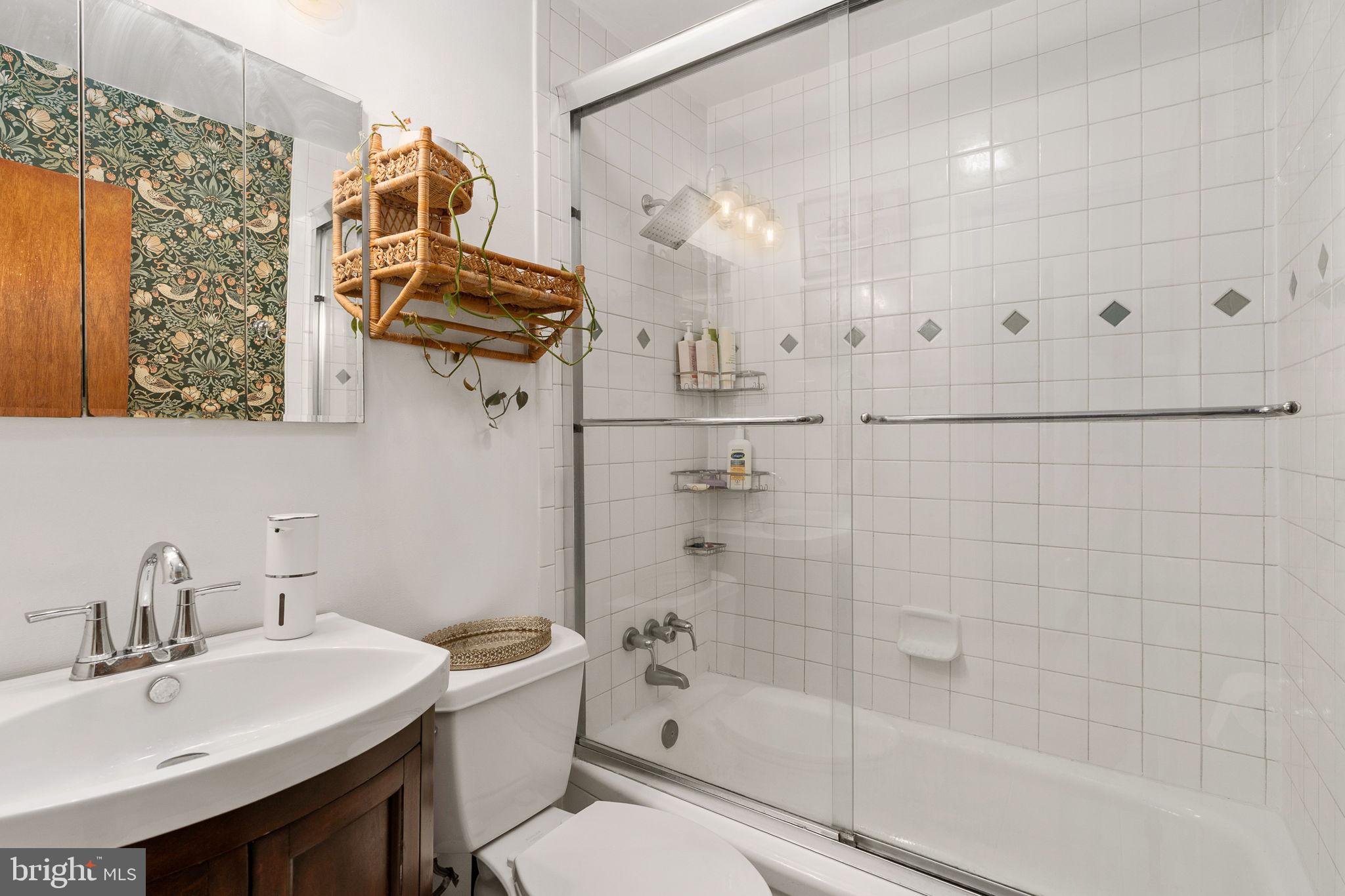 6714 Ruskin Street Springfield, VA 22150 - Photo 31 of 63 a bathroom with a sink a toilet and shower