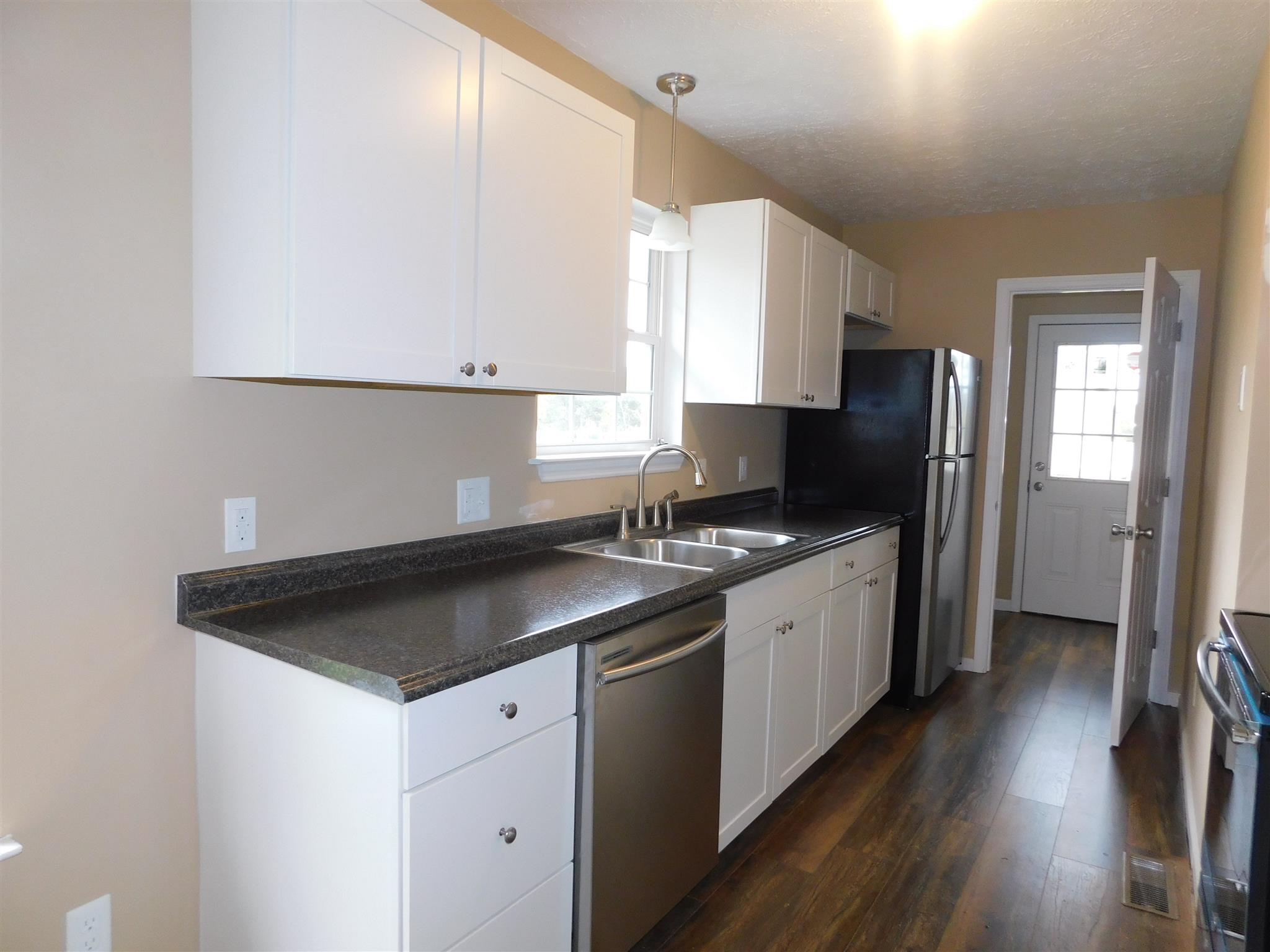 125 Rodeo Drive Columbia, TN 38401 - Photo 4 of 13 Kitchen has new cabinets, stainless appliances, new flooring, all repainted.