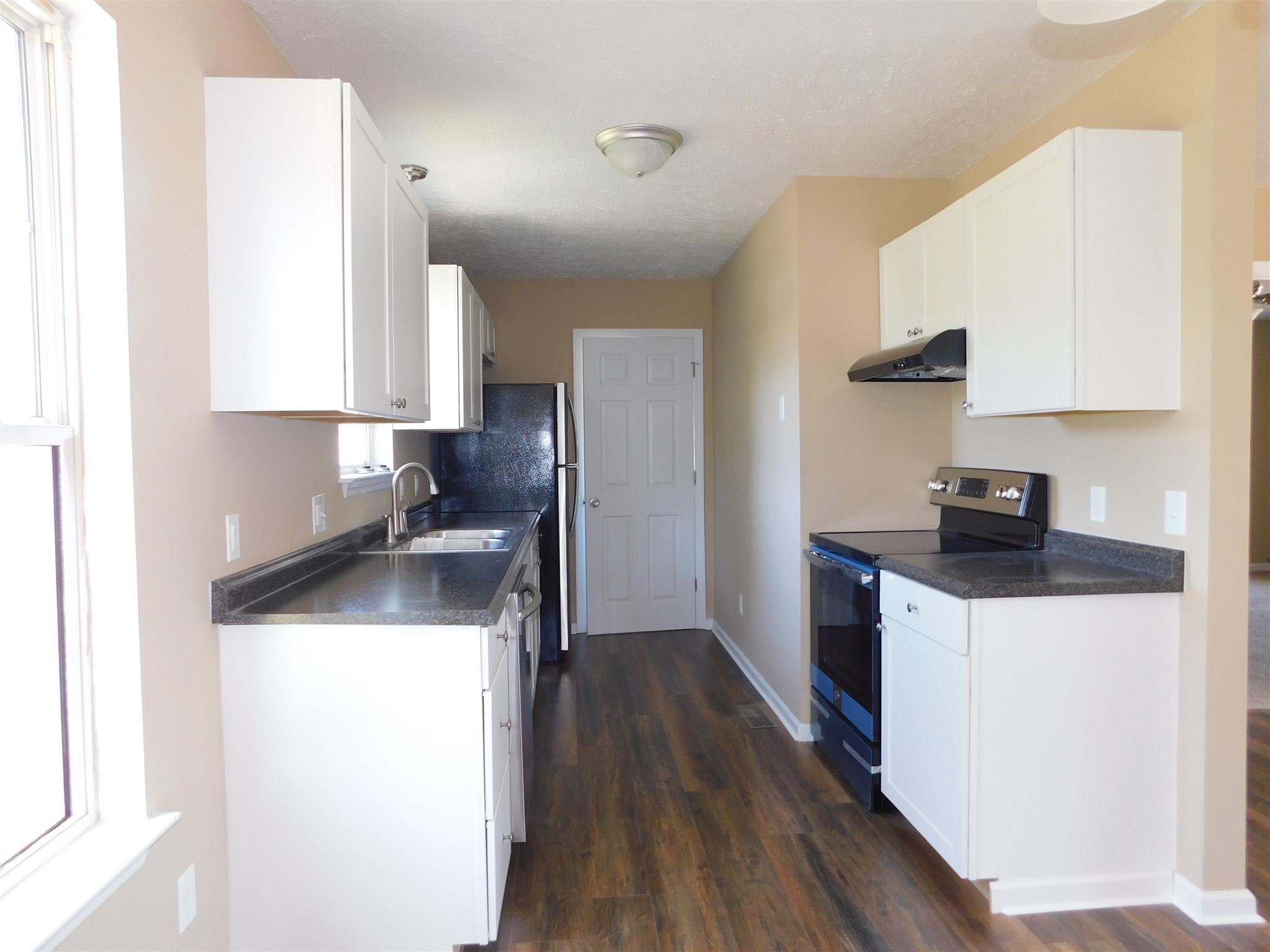 125 Rodeo Drive Columbia, TN 38401 - Photo 5 of 13 Everything brand new makes this an easy workable kitchen.