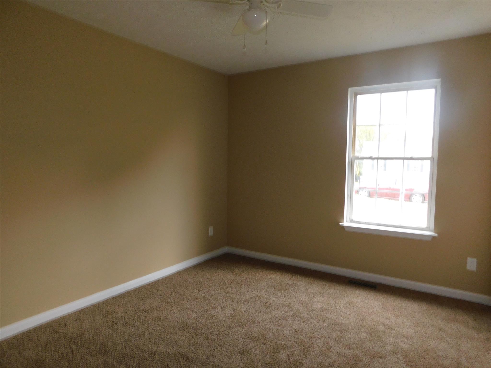 125 Rodeo Drive Columbia, TN 38401 - Photo 10 of 13 Bedroom 3, new carpet, all new paint, new ceiling fan.