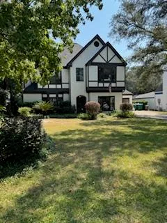 a view of a house with swimming pool