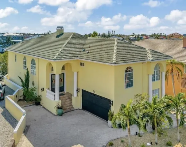 an aerial view of a house with a terrace