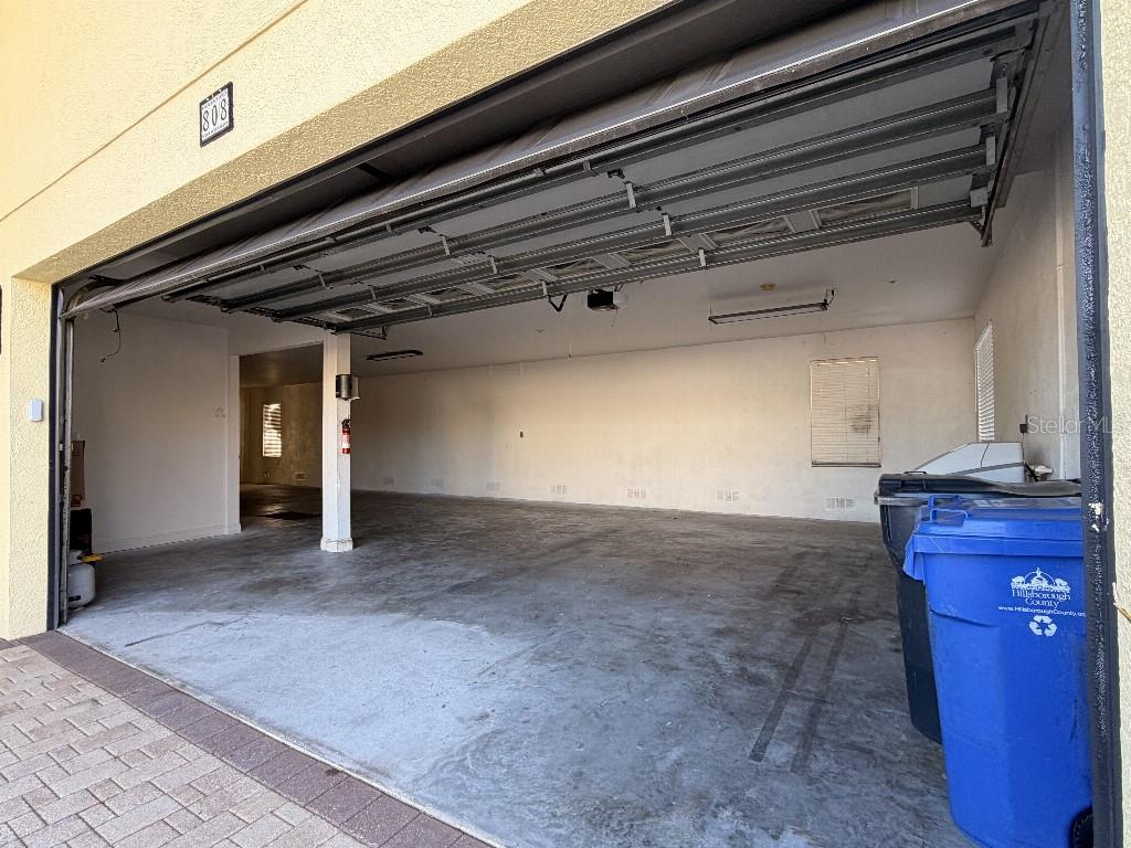 808 Symphony Isles Boulevard Apollo Beach, FL 33572 - Photo 13 of 50 a view of a garage
