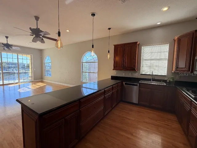 a close view of a stove a microwave and cabinets