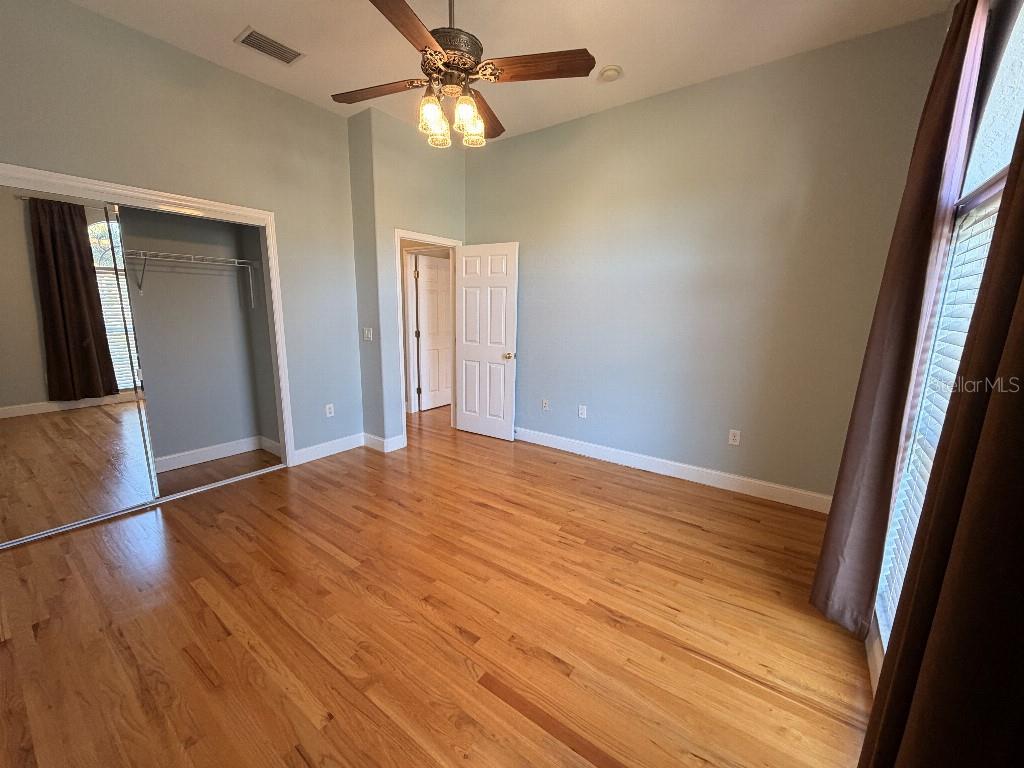808 Symphony Isles Boulevard Apollo Beach, FL 33572 - Photo 33 of 50 a view of empty room with wooden floor