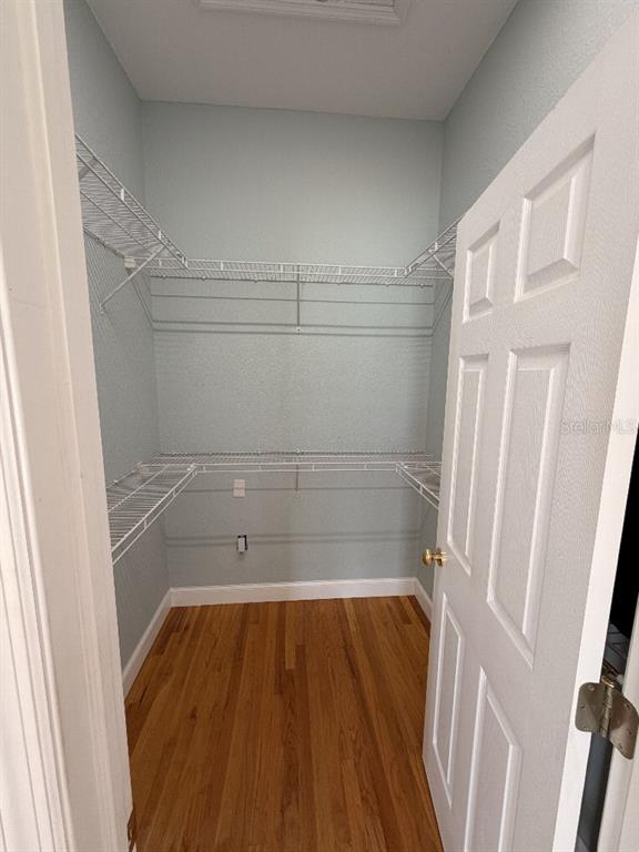 808 Symphony Isles Boulevard Apollo Beach, FL 33572 - Photo 34 of 50 view of a room with wooden floor