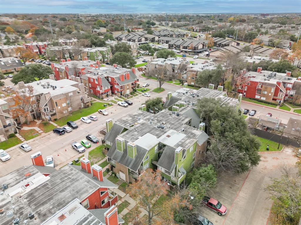 9823 Walnut Street, Unit 304 Dallas, TX 75243 - Photo 24 of 26 an aerial view of residential houses with outdoor space