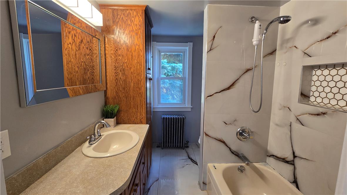 883 North Locust Street Hazleton, PA 18201 - Photo 52 of 83 Refined bath featuring contemporary tilework and a window offering natural illumination.