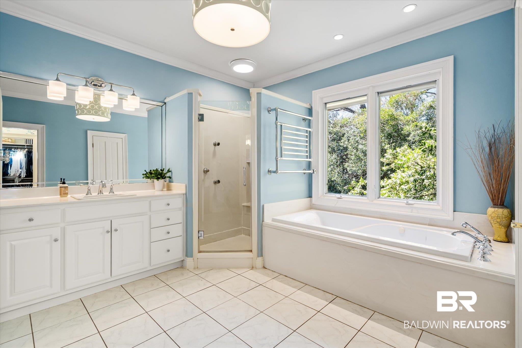 4 Kingsway Mobile, AL 36608 - Photo 21 of 44 Full bath featuring tile patterned flooring, a shower stall, crown molding, a garden tub, and vanity
