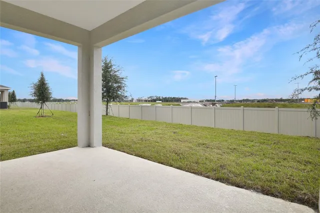 a view of a lake with a big yard
