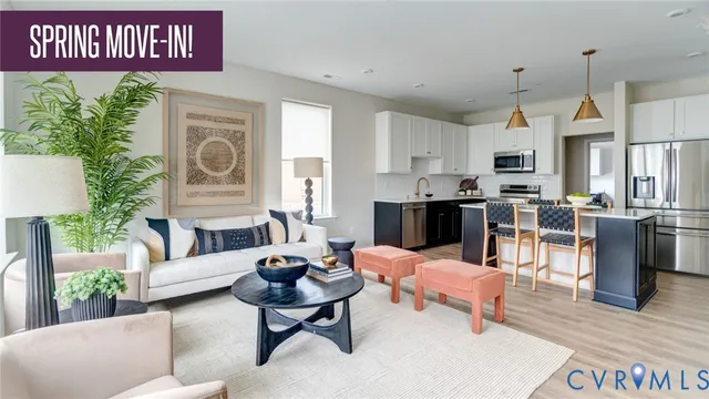 a living room with fireplace furniture and a large window