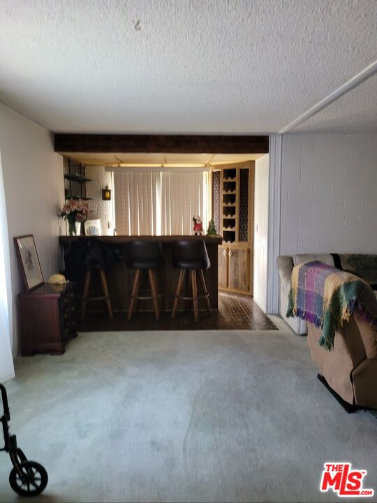 17700 South Avalon Boulevard, Unit 418 Carson, CA 90746 - Photo 13 of 16 a living room with furniture and a large window