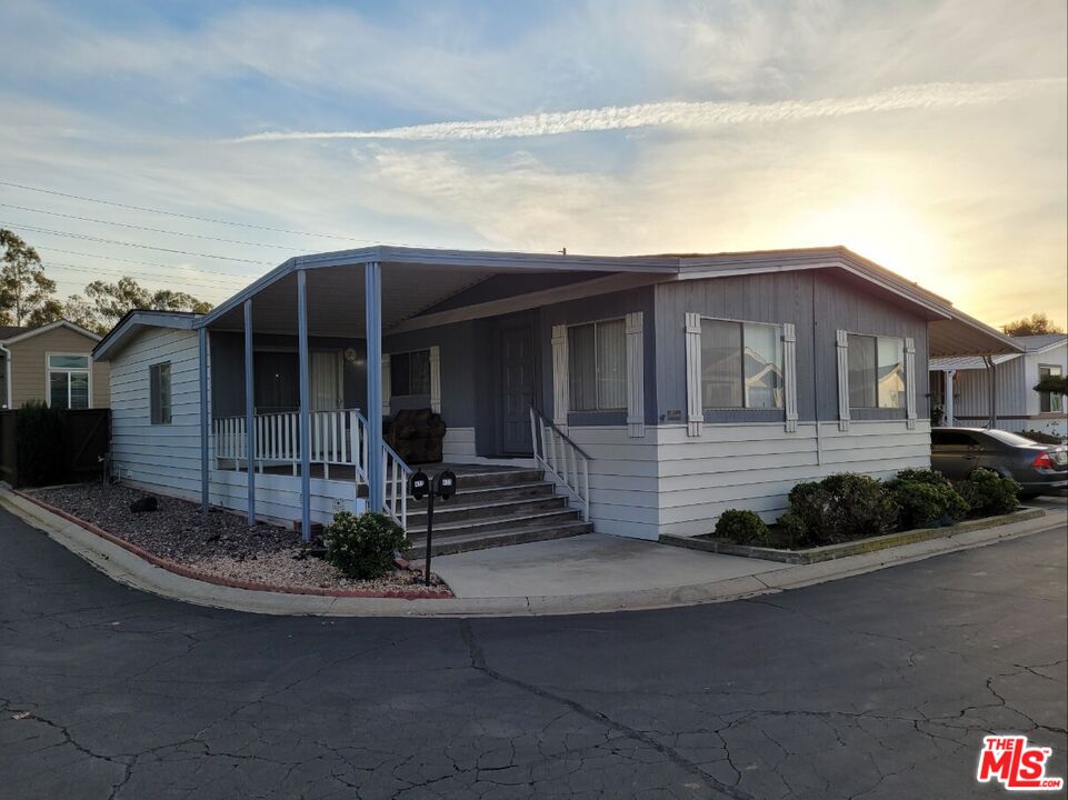 17700 South Avalon Boulevard, Unit 418 Carson, CA 90746 - Photo 2 of 16 a front view of a house with garage