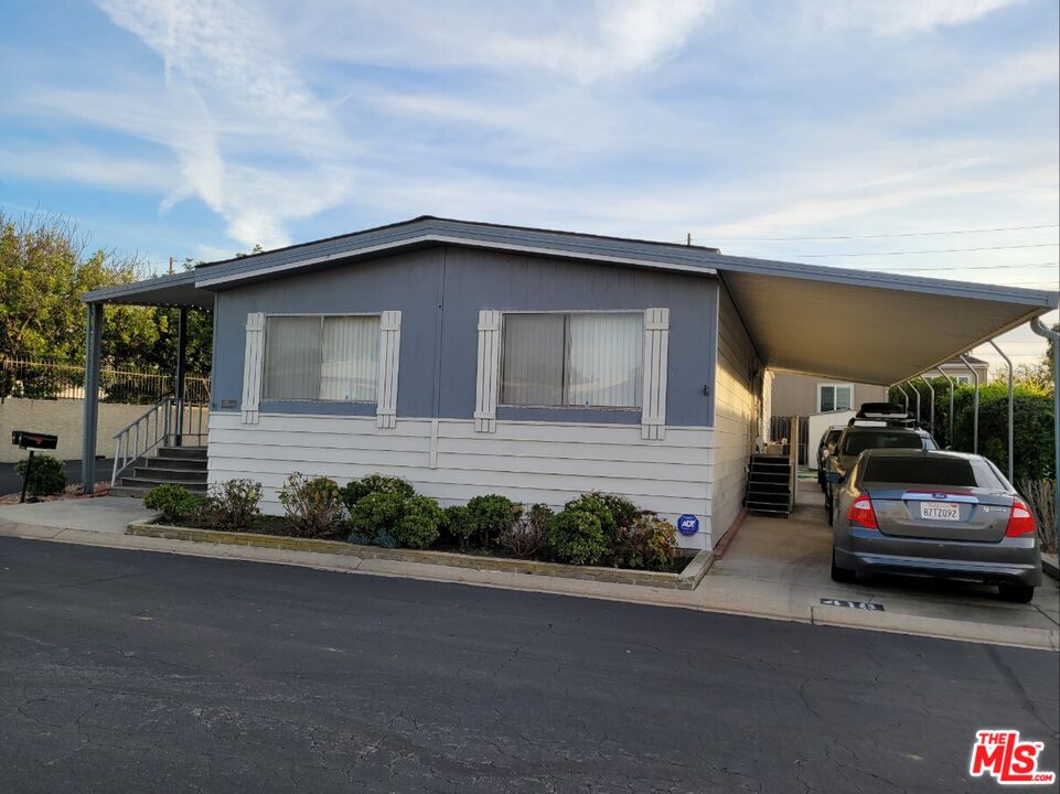 17700 South Avalon Boulevard, Unit 418 Carson, CA 90746 - Photo 3 of 16 a car parked in front of a house