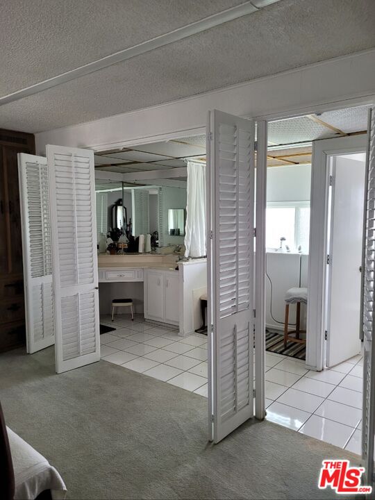 17700 South Avalon Boulevard, Unit 418 Carson, CA 90746 - Photo 5 of 16 a en suite bathroom with a sink and a mirror