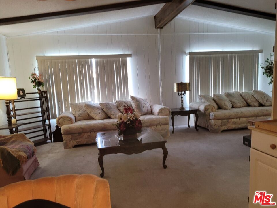 17700 South Avalon Boulevard, Unit 418 Carson, CA 90746 - Photo 6 of 16 a living room with furniture and a large window