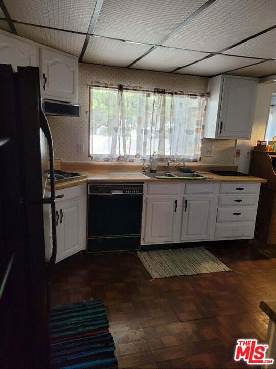 17700 South Avalon Boulevard, Unit 418 Carson, CA 90746 - Photo 9 of 16 a kitchen with granite countertop a sink stainless steel appliances and cabinets