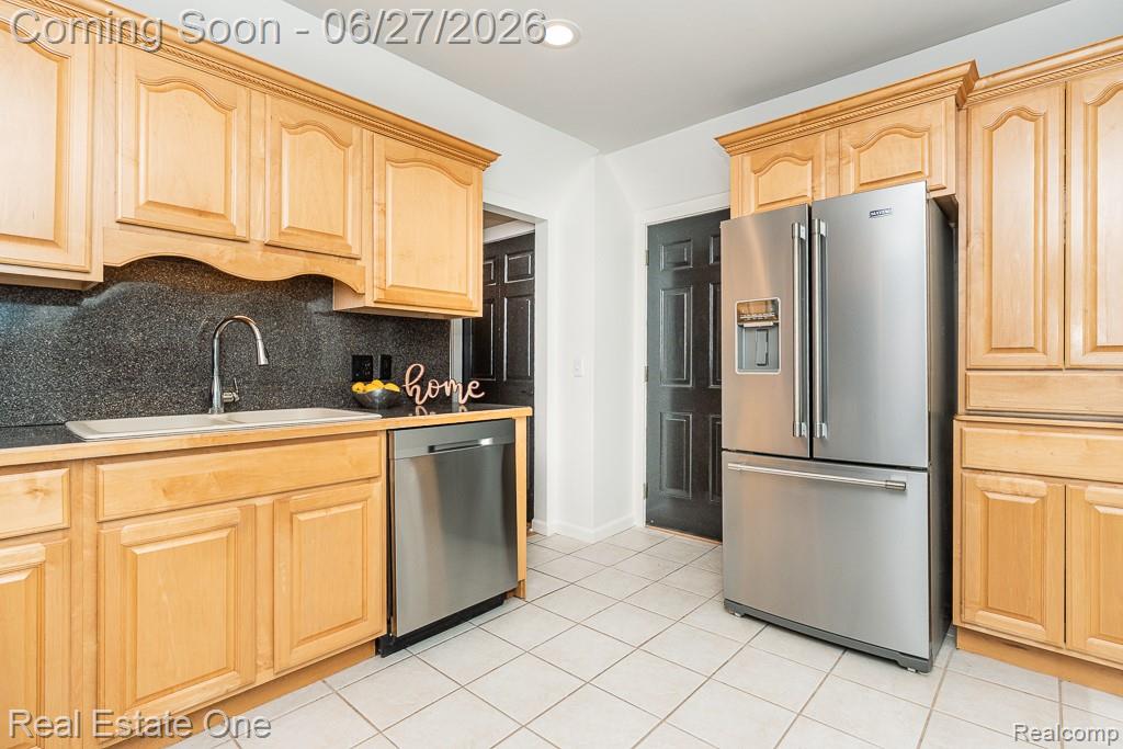 1222 Kings Cove Court, Unit 244 Rochester, MI 48306 - Photo 13 of 44 Tile counter and backsplash plus pantry closet for added storage, Stainless Dishwasher/Refrigerator