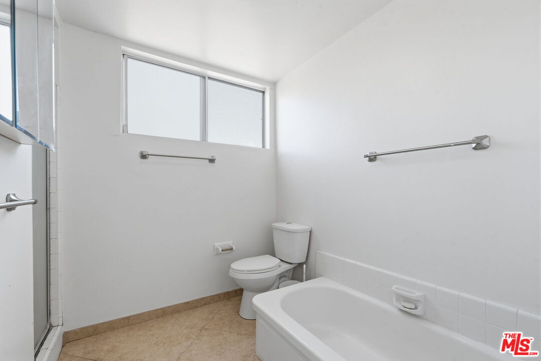 28370 Rey De Copas Lane Malibu, CA 90265 - Photo 18 of 33 a white toilet sitting next to a bathroom sink