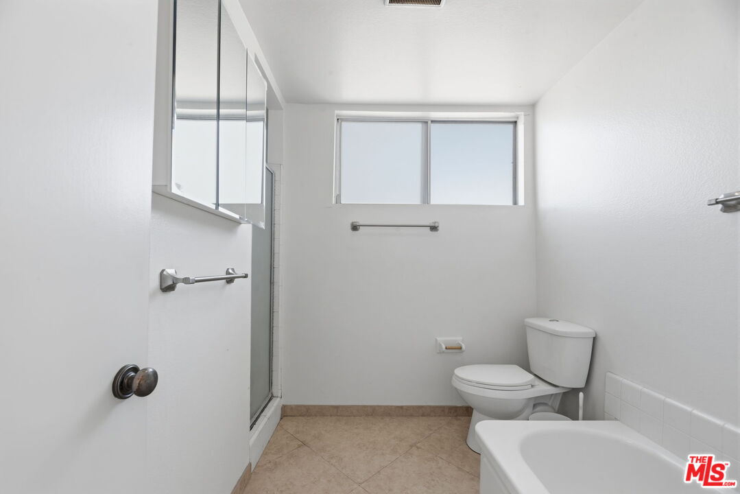 28370 Rey De Copas Lane Malibu, CA 90265 - Photo 19 of 33 a bathroom with a toilet and a shower