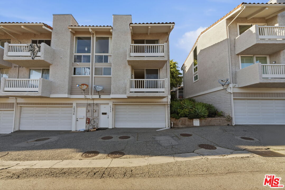 28370 Rey De Copas Lane Malibu, CA 90265 - Photo 28 of 33 a front view of a house with a yard