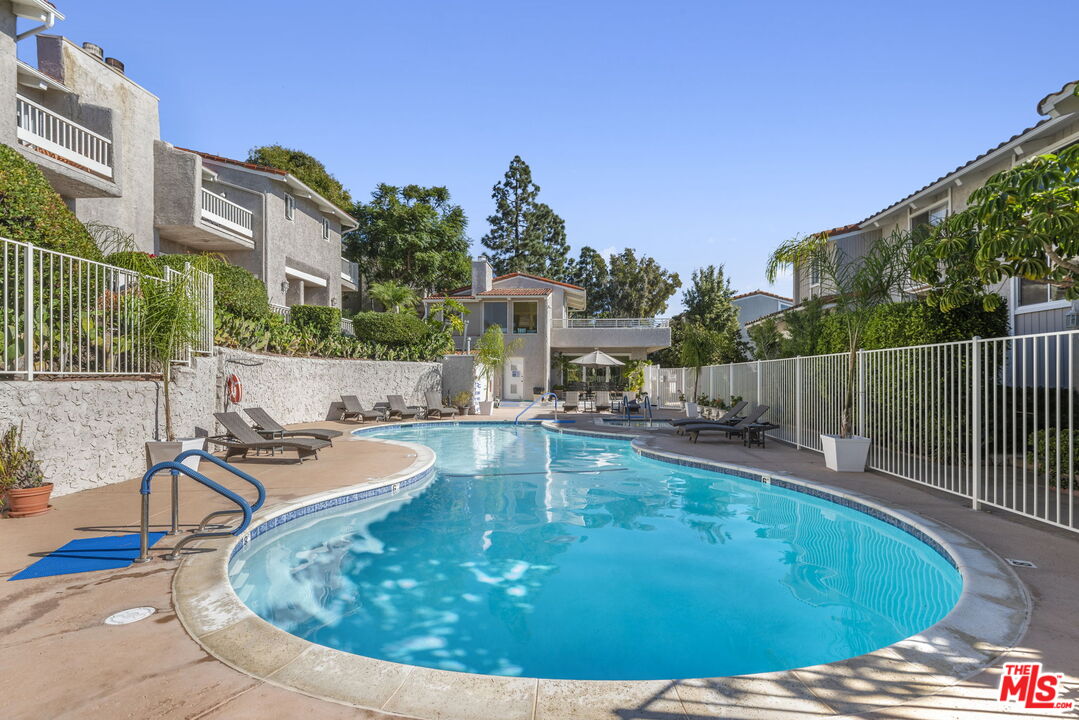 28370 Rey De Copas Lane Malibu, CA 90265 - Photo 30 of 33 a view of a swimming pool with a patio
