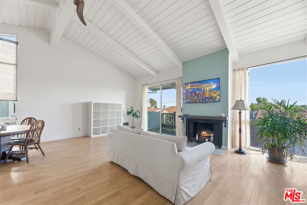 28370 Rey De Copas Lane Malibu, CA 90265 - Photo 3 of 33 a living room with furniture and a fireplace