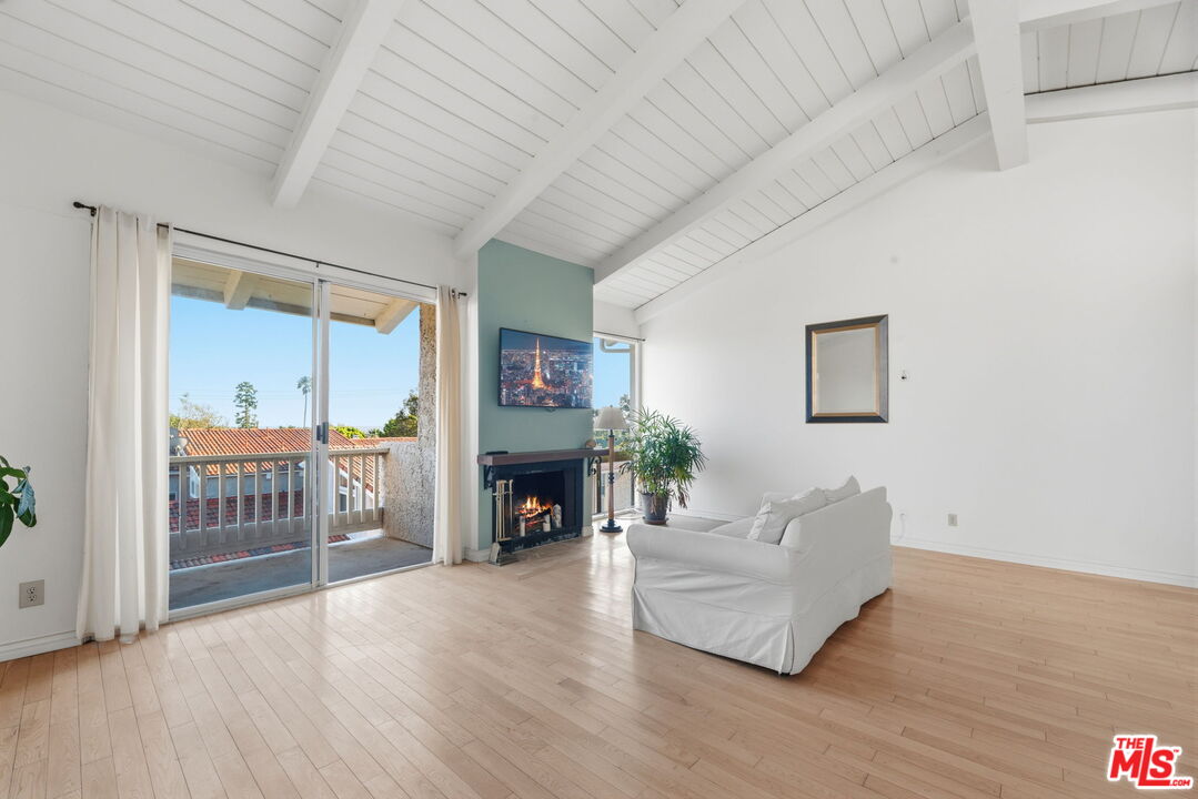 28370 Rey De Copas Lane Malibu, CA 90265 - Photo 4 of 33 a living room with furniture and a fireplace