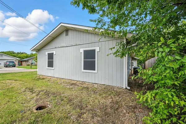 a house with trees in front of it