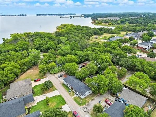an aerial view of a house with a lake view
