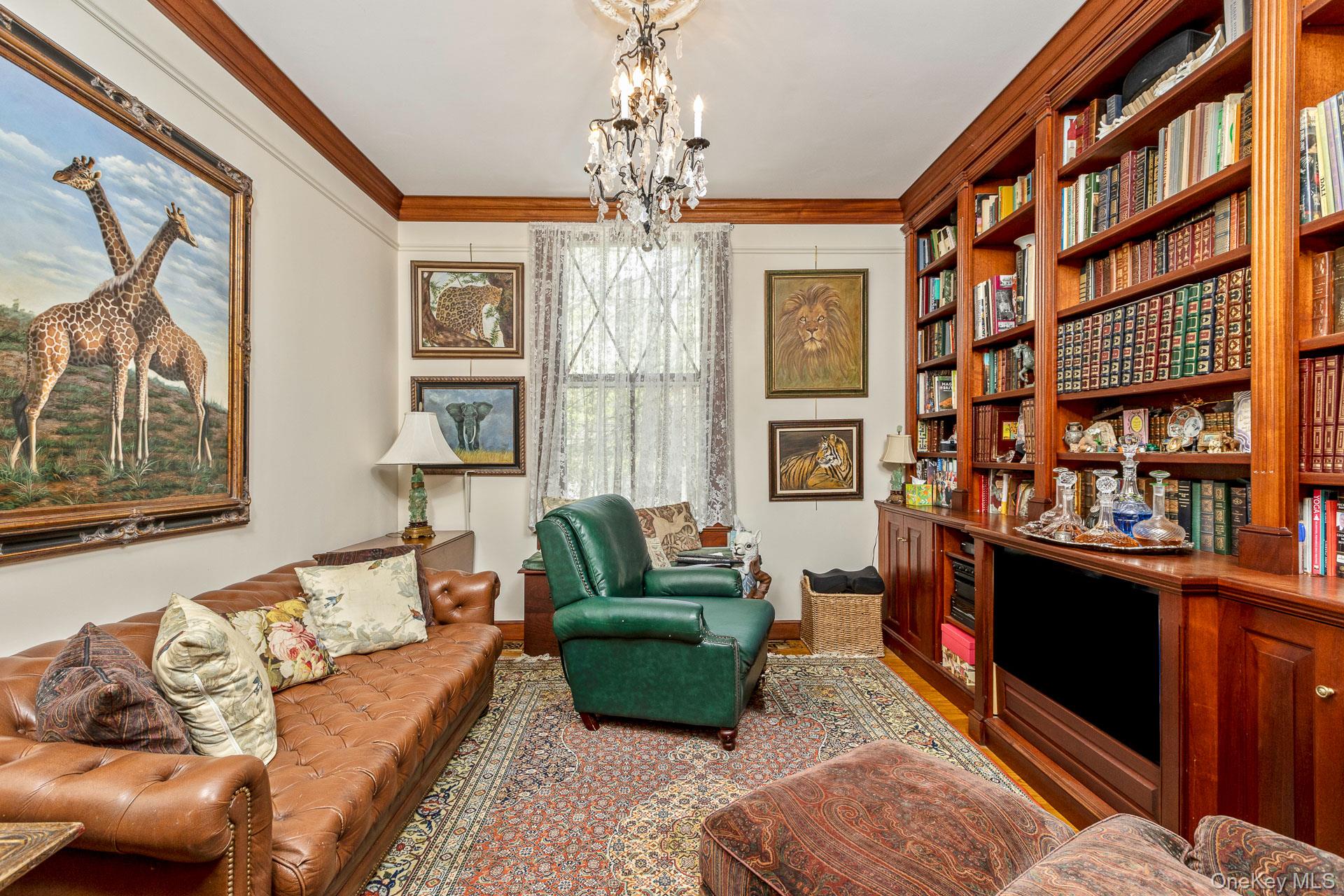 4 Horse Hollow Road Locust Valley, NY 11560 - Photo 14 of 48 a living room with furniture or window and a chandelier