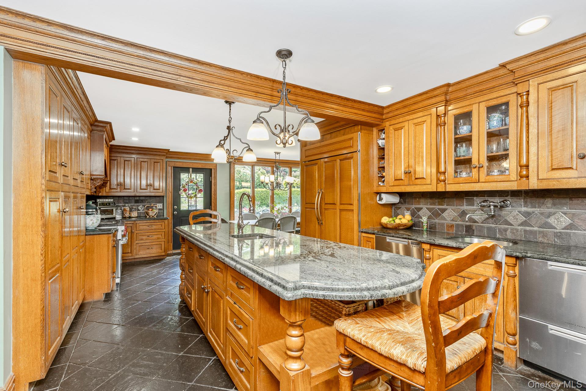 4 Horse Hollow Road Locust Valley, NY 11560 - Photo 16 of 48 a kitchen with stainless steel appliances granite countertop a sink and cabinets